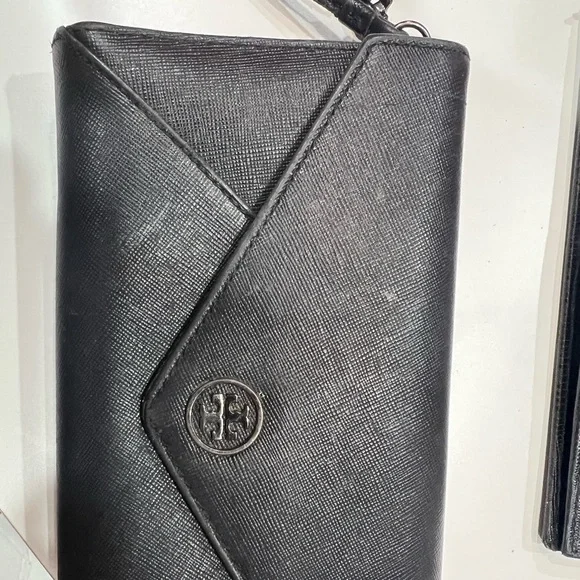 Tory Burch black large wallet with many compartments.